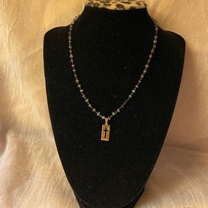 CHEL- Religious beaded necklace w/cut out cross pendant. Gold colored 16” long